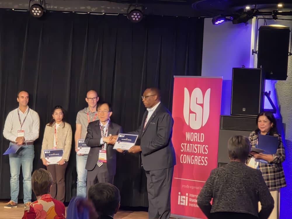 ZamStats Board Chairperson Receives an award during the ISI World Statistics Congress